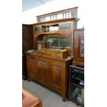 A LATE VICTORIAN CARVED OAK ART NOUVEAU DESIGN MIRROR BACK SIDEBOARD, THE ARCADED BACK INCORPORATING