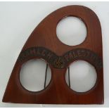 AN EARLY 20TH CENTURY TRIPLE PHOTOGRAPH FRAME formed from the end of a wooden propeller blade