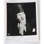 TOMMY COOPER SIGNED BLACK AND WHITE BUST PORTRAIT PHOTOGRAPH in evening jacket and fez, signed in