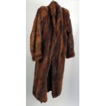 LADY'S FULL LENGTH BROWN MUSQUASH FUR COAT, fold over collar, full sleeves, hook fastening