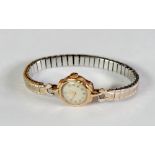 LADY'S TUDOR 9CT GOLD CASED WRIST WATCH, 17 rubies, arabic dial, Edinburgh 1963, on an expanding