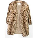 THREE VARIOUS THREE QUARTER LENGTH FUR COATS and a faux leopard fur three quarter length coat (4)