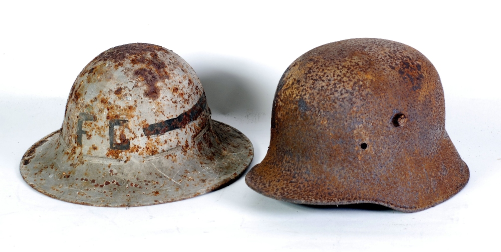 GERMAN M1916 DESIGN WWI TIN HELMET, very rusty and lacking any fittings and a BRITISH STYLE STEEL