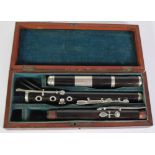 A 19TH CENTURY MAHOGANY CASED FRENCH EBONY AND WHITE METAL PICILO-FLUTE