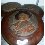 THREE CIRCA 1920's CAST EMBOSSED COPPER PLAQUES OF 'BEETHOVEN', 'MOZART' AND ANOTHER ON CIRCULAR OAK