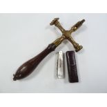 A VICTORIAN WOODEN HANDLED BRASS PASTRY CRIMPING AND DECORATING IMPLEMENT, also a mother o pearl and