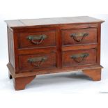 CONTINENTAL TEAK? CHEST OF DRAWERS, the moulded oblong top above four deep drawers, fitted with