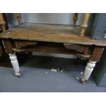 A EARLY 20TH CENTURY KITCHEN TABLE, FORMERLY PAINTED, PLANK TOP ON TURNED SUPPORTS, AND A SIMILAR