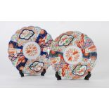 PAIR OF JAPANESE IMARI CIRCULAR PLAQUES, with red flower centres and glazed in red, blue and