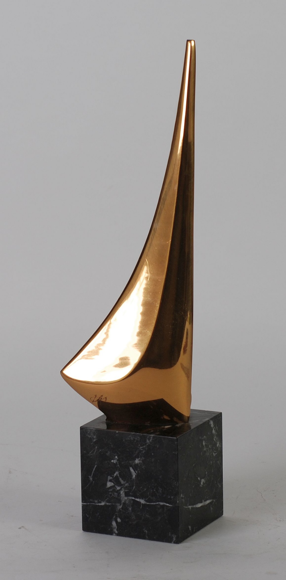 ITALICA MODERN SPANISH POLISHED BRONZE SCULPTURE, modelled as a stylised yacht on a cresting wave,