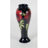 WALTER MOORCROFT ANEMONE PATTERN TUBE LINED POTTERY VASE, of slender ovoid form with lipped rim,