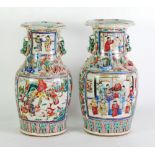 A PAIR OF NINETEENTH CENTURY CHINESE PORCELAIN FAMILLE ROSE DECORATED MALLET FORM VASES,