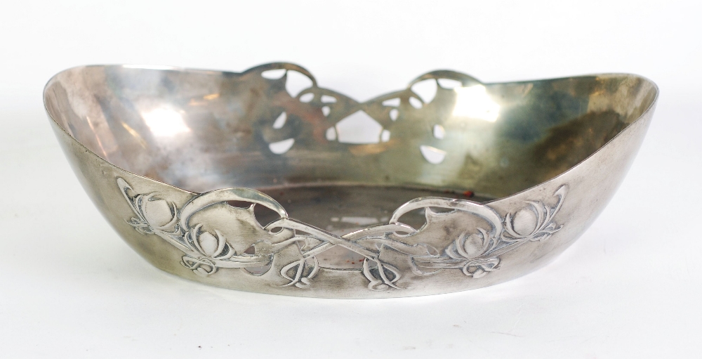 ART NOUVEAU TUDRIC PEWTER EMBOSSED AND PIERCED DISH, of shallow oval form, embossed with