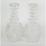 PAIR OF GEORGIAN STYLE CUT GLASS DECANTERS AND STOPPERS, of baluster form with ring moulded necks