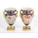 PAIR OF EARLY NINETEENTH CENTURY MASONS 'PATENT IRONSTONE' CHINA TWO HANDLED PEDESTAL VASES, of