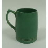 KEITH MURRAY FOR WEDGWOOD, GREEN GLAZED POTTERY MUG, 5" (12.7cm) high, printed mark