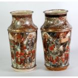 A PAIR OF LATE NINETEENTH/EARLY TWENTIETH CENTURY JAPANESE FAYENCE VASES, enamelled and gilt with