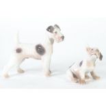 TWO MODERN BING & GRONDAHL DANISH PORCELAIN MODELS OF DOGS WITH BROWN SPLASHED COATS, one modelled