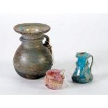 PROBABLY ROMAN OPALESCENT GLASS GLOBULAR JUG, having waisted neck and broad everted rim with