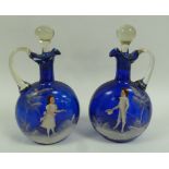 PAIR OF NINETEENTH CENTURY 'MARY GREGORY' BLUE GLASS CLARET JUGS, of flask form with loop handles,