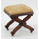 VICTORIAN MAHOGANY X FRAME STOOL with square, padded seat covered in old gold floral fabric and