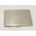 SILVER OBLONG POCKET CIGARETTE CASE, with engine turned decoration, 3 3/4" (9.5cm) wide,