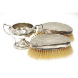 A PAIR OF GENTLEMAN'S MILITARY HAIR BRUSHES with engine turned silver backs, Birmingham 1910, and