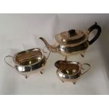 GEORGIAN STYLE THREE PIECE SILVER TEA SET, TEAPOT with blackwood insulator handle and finial, raised