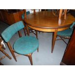 A EIGHT PIECE G-PLAN DINING ROOM SUITE COMPRISING; CIRCULAR EXTENDABLE DINING TABLE, SIX CHAIRS WITH