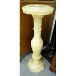 A CREAM ALABASTER PEDESTAL WITH CIRCULAR TOP AND OCTAGONAL BASE, 2'6" HIGH