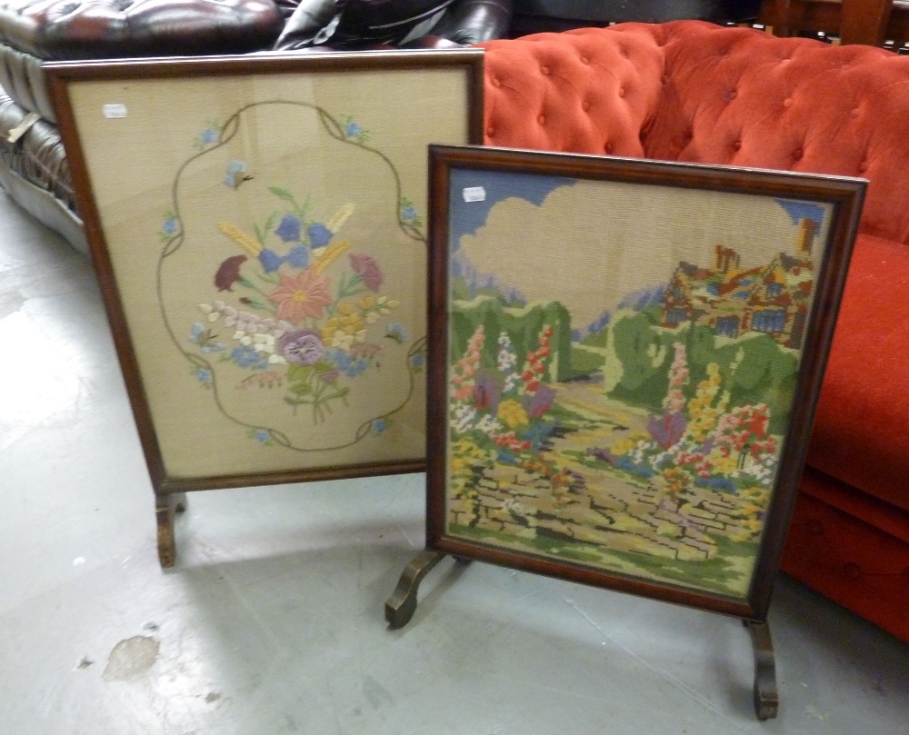 TWO MAHOGANY CHEVAL GRATE SCREENS WITH GLAZED AND PICTORIAL NEEDLEWORK TAPESTRY PANELS