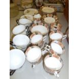 A GLADSTONE CHINA TEA SET AND A WINDSOR 'CAMILLE' TEA SET FOR 6 PERSONS