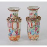 PAIR OF LATE NINETEENTH CENTURY CHINESE CANTON FAMILLE ROSE VASES, with gilt lion mask captive