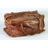 WORLD WAR II BROWN LEATHER HOLDALL INDISTINCTLY MARKED 'L.F. T.C....' WITH TWO SHORT STRAPS AND