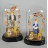 PAIR OF VICTORIAN PAINTED COMPOSITION AND SILK CONFECTION OF MALE AND FEMALE ARBOUR FIGURES, beneath