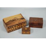 A JAPANESE PARQUETRY AND MARQUETRY INLAID BOX, TWO SMALLER BOXES AND AN ARTICULATED SILVERED