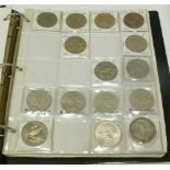 A RED COIN ALBUM CONTAINING APPROX 173 UK AND WORLD 'CROWNS' and other coins and a few medallions (