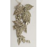 LARGE SILVER AND PASTE SET FLORAL AND FOLIATE SPRAY BROOCH, descending in three sections, 3 1/2"