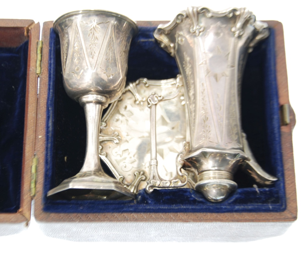 VICTORIAN CASED THREE PIECE BRIGHT CUT SILVER TRAVELLING COMMUNION SET, the wine jug with screw