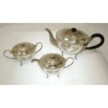 PROBABLY INDIAN THREE PIECE ENGRAVED SILVER COLOURED METAL TEA SET, with lids, of oval form with