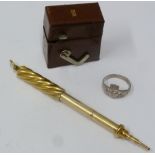 MORDEN AND CO., GOLD COLOURED METAL PROPELLING PENCIL, with spirally fluted case with ring hanger,