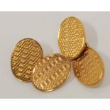 PAIR OF 9ct GOLD DOUBLE OVAL CUFF LINKS with engine turned decoration, Birmingham 1922, 13.8gms