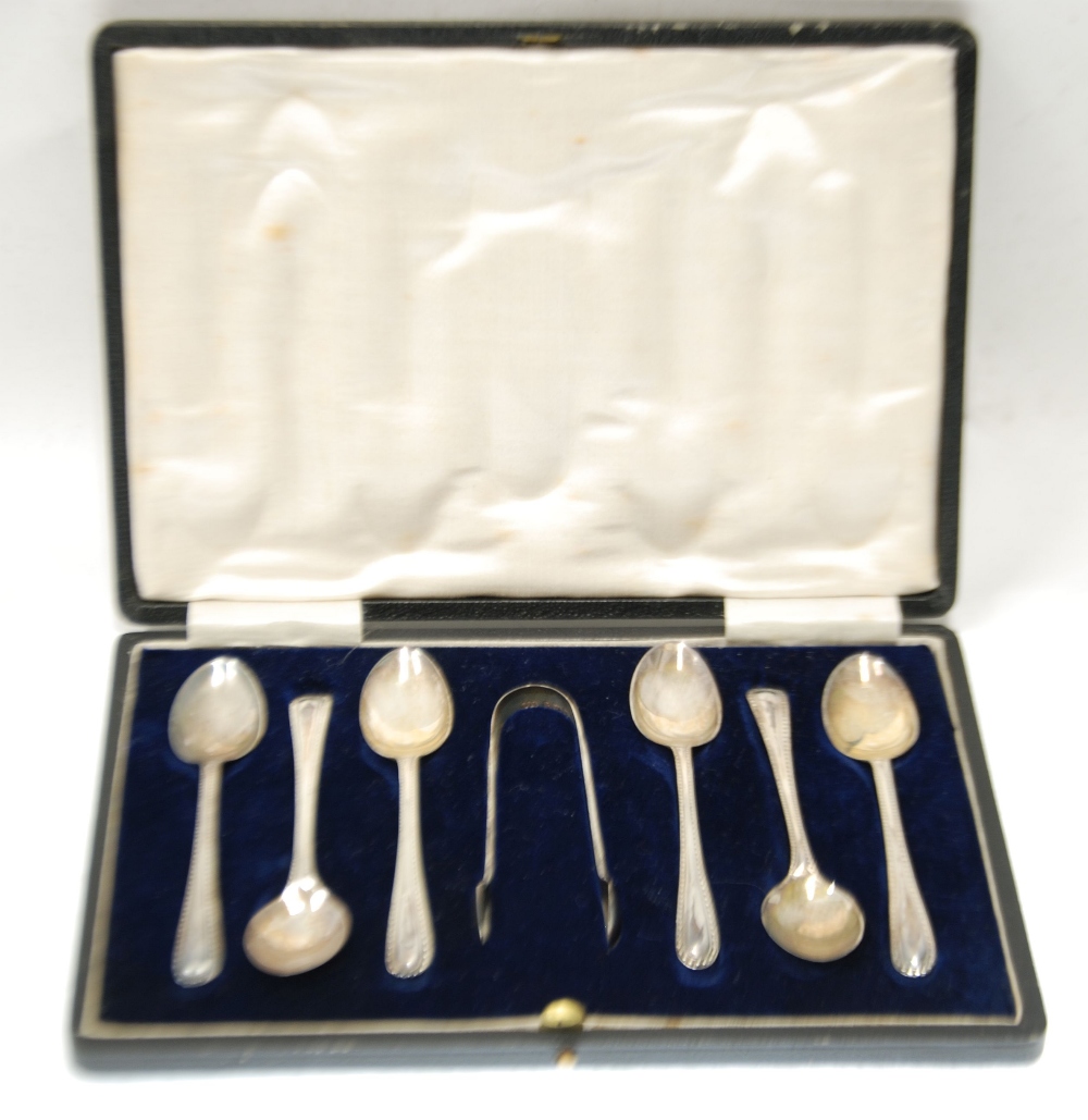 CASED SET OF SIX GEORGE V SILVER BEAD EDGE COFFEE SPOONS AND MATCHING PAIR OF SUGAR TONGS, Sheffield