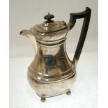 PRE-WAR SILVER COFFEE POT of rounded oblong form with blackwood harp-shape handle and knop, on