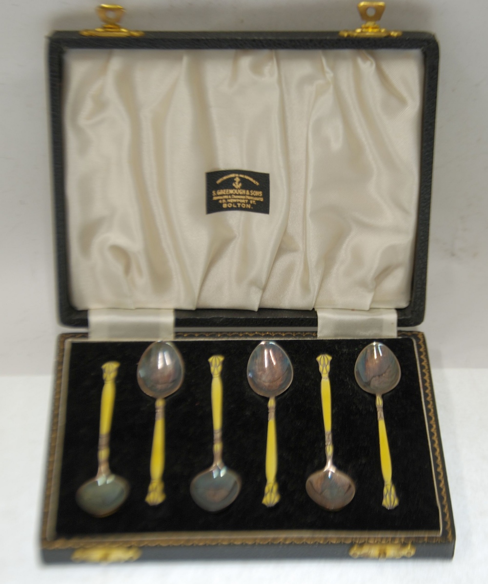 CASED SET OF SIX SILVER AND YELLOW GUILLOCHE ENAMELLED COFFEE SPOONS, decorated to both sides of the