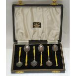 CASED SET OF SIX SILVER AND YELLOW GUILLOCHE ENAMELLED COFFEE SPOONS, decorated to both sides of the