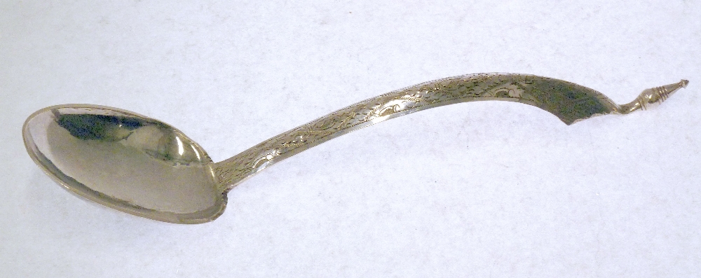 EARLY TWENTIETH CENTURY PROBABLY PERSIAN SILVER COLOURED METAL SERVING SPOON, with lightly planished