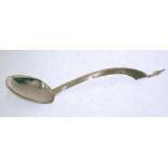 EARLY TWENTIETH CENTURY PROBABLY PERSIAN SILVER COLOURED METAL SERVING SPOON, with lightly planished