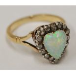 EARLY TWENTIETH CENTURY 18ct GOLD, OPAL AND DIAMOND CLUSTER RING, set with a heart shaped opal and