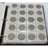A BLUE COIN ALBUM CONTAINING APPROX 121 COINS, mainly Elizabeth II UK and Commonwealth 'Crowns' also